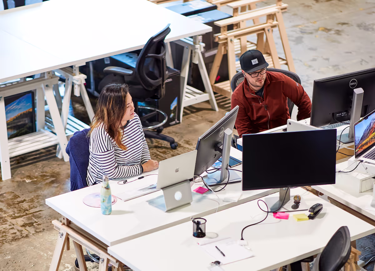 Small business team collaborating at a shared workspace